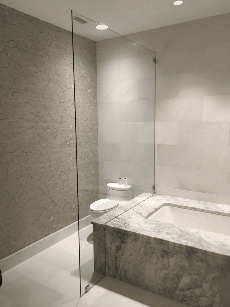 Frameless shower panel Tub Shower Enclosure - Frameless Showers project by Custom Glass Works