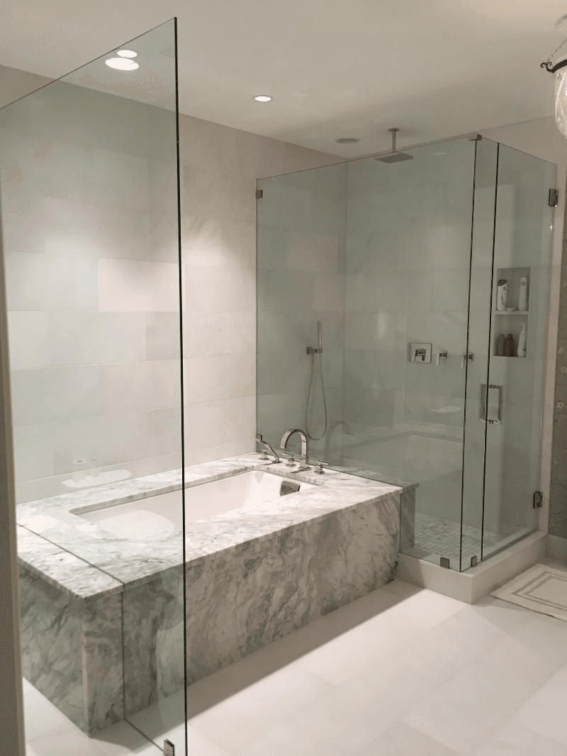 Frameless shower panel Tub Shower Enclosure 2 - Frameless Showers project by Custom Glass Works