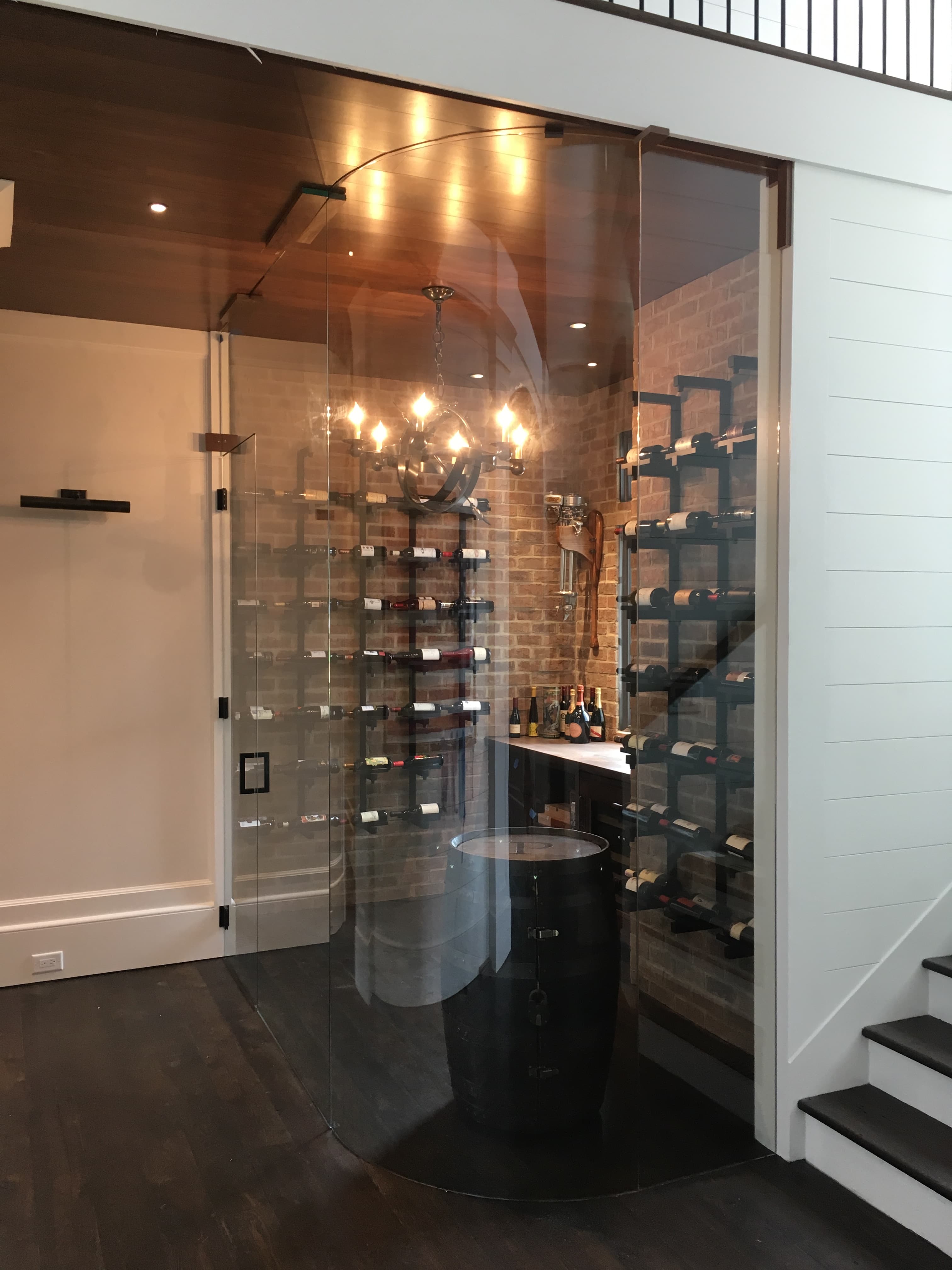 Curved glass wine room crafted by Custom Glass Works